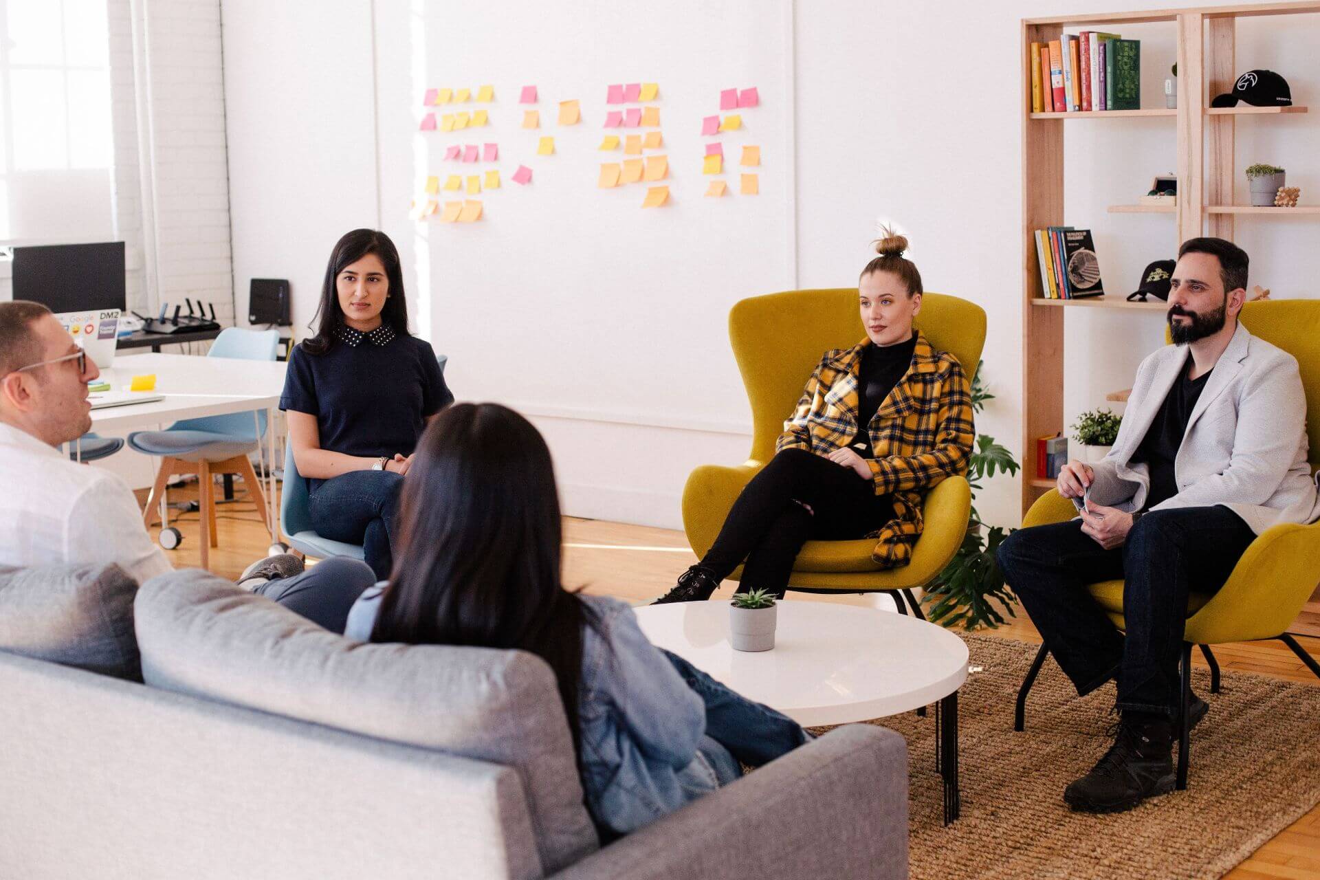photo of people sitting on lounges in modern office space